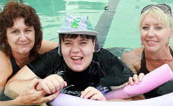 Carers Sharon White, left, and Sam Moore, right, assist Tahlia Hardwick with her aqua therapy. Tahlia holds a Companion Card which allows one of her carers free entry to the Hervey Bay Aquatic Centre. Carers Sharon White, left, and Sam Moore, right, assist Tahlia Hardwick with her aqua therapy. Tahlia holds a Companion Card which allows one of her carers free entry to the Hervey Bay Aquatic Centre.